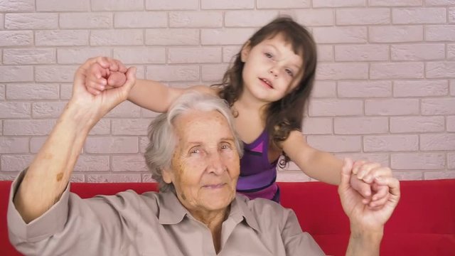 Grandmother plays with her granddaughter.