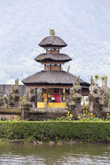 Fototapeta na wymiar Pura Ulun Danu Bratan temple in Bali island. Hindu temple in flowers on Beratan lake, Asia