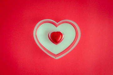 Red background with heart rests in the concept of Valentine's Day.