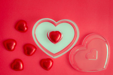 Obraz premium Red background with heart rests in the concept of Valentine's Day.