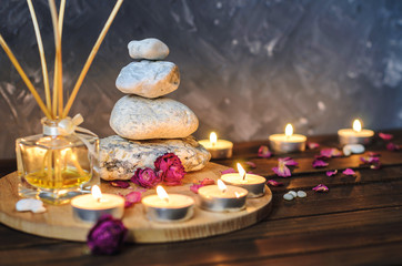 Spa composition-stones, candles, aromatherapy, dry flowers.