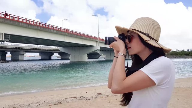 the lady taking a photo of the Naminoue Beach