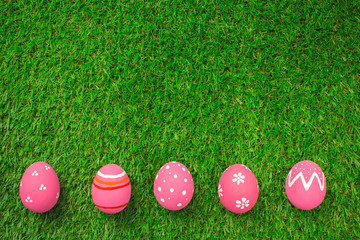 Easter eggs on the green grass.