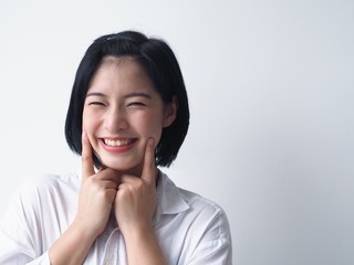 Fototapeta na wymiar Happy Young Asian woman standing over white background.