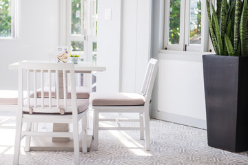 Modern white table and chair set in a cafe