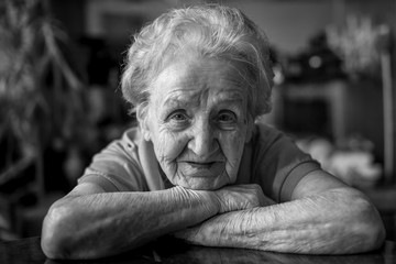 Black and white portrait of an elderly woman, close-up.