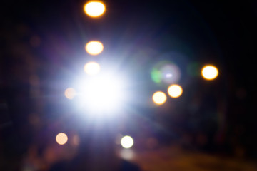 Runner take a head lamp on his head in the night, white rim light.