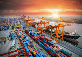 Logistics and transportation of Container Cargo ship and Cargo plane with working crane bridge in...