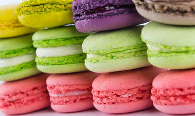 background of different colors from a delicious dessert macaron, like a wall