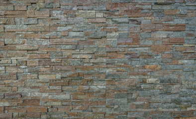 Stack pattern of stone wall background.