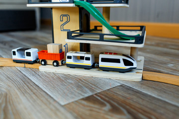 A toy train at the toy railway station with multi-level parking 