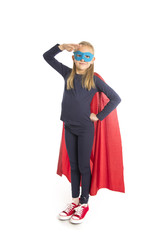 7 or 8 years old young female schoolgirl child in super hero costume performing happy and excited isolated on white background