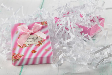 beautiful miniature striped gift box with lettering and bow