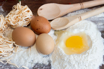 ingredients preparation spaghetti with eggs, tomatoes herbs and spices