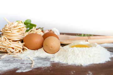 ingredients preparation spaghetti with eggs, tomatoes herbs and spices