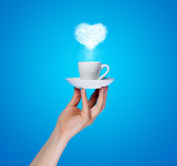 Heart from steam and cup of coffee