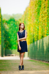 girl in blue dress posing in Garden of Verssailles