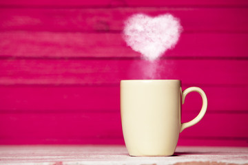 Heart shape steam from a cup of coffee