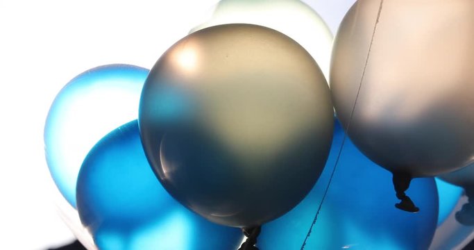 blue and white balloon floating swivel decoration in birthday anniversary celebration party