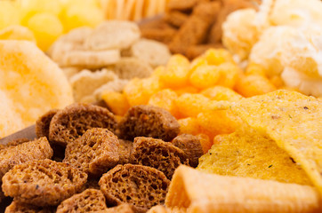 Different mexican beer snacks as background, closeup. Fast food backdrop.