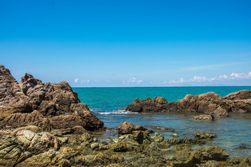 Fototapeta na wymiar Sea rocks and blue sky