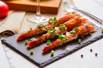 Shrimp stuffed with herbs and slices of vegetables