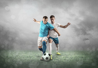 Obraz na płótnie Canvas Soccer player on a football field in dynamic action at summer da