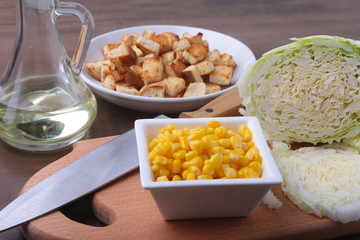 Fresh Chinese cabbage, Sweet canned corn, Delicious crispy croutons and canned tuna. Ingredients for dietary salad.