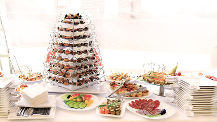 catering table set service with silverware and glass