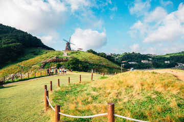 Fototapeta na wymiar Windmill and nature view at Hill of wind in Geoje, Korea