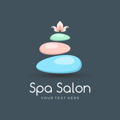 Spa color logo with spa the balancing stones and lotus flower - a symbol of harmony, tranquility and relaxation. Logo template for beauty salon, yoga center or spa lounge.