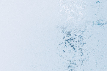 Winter texture. Frosts on the glass. Frosty day Sunset on the winter day through the window.
