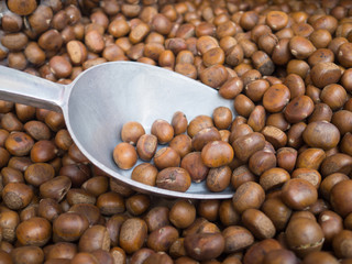 Chestnuts roasted for sale in a market.
