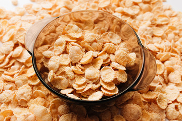 delicious crispy cornflakes in bowl,  healthy breakfast