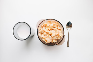 Delicious crispy cornflakes in bowl on white background, healthy breakfast