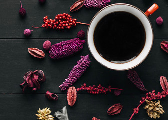 Chinese herbal tea with dried herbs and flowers on dark wooden table