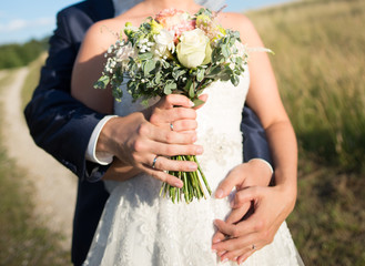 Wedding bouquet in hand - outdoor summer wedding