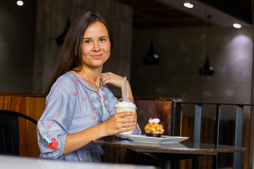 Young woman have fun in cafe at breakfast