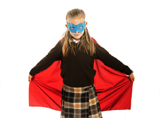 7 or 8 years old young female child in super hero costume over school uniform  performing happy and excited isolated on white background