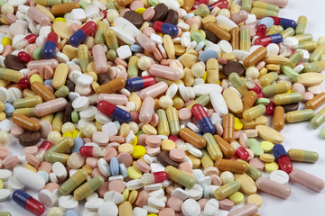 Many pills and tablets isolated on white background

