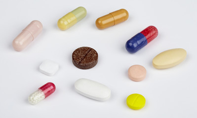 Many pills and tablets isolated on white background