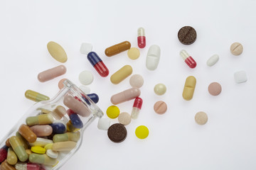 Many pills and tablets isolated on white background