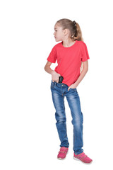 Fototapeta premium Portrait of a young girl looking sideways with a gun behind her belt isolated on white background