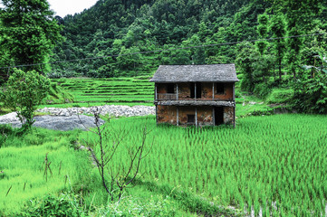 Side-by-side The countryside of Nepal is an ancient house that is still preserved. Old culture