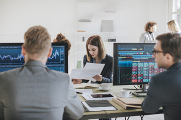 Businesspeople Working at Stock Exchange Market