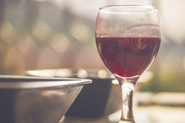 Red wine in dirty wine glass left on table