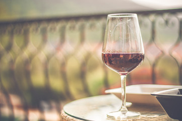 Red wine in dirty wine glass left on table