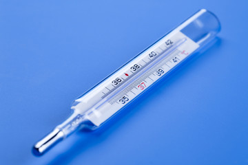 Obraz premium medical thermometer on a blue