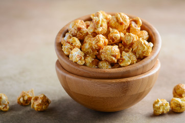 Homemade Caramel Popcorn in a wooden bowl.