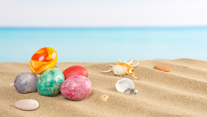 Fototapeta na wymiar Easter on beach background. Eggs